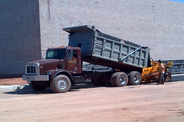 FINE GRADE & PAVE of a commercial parking lot.